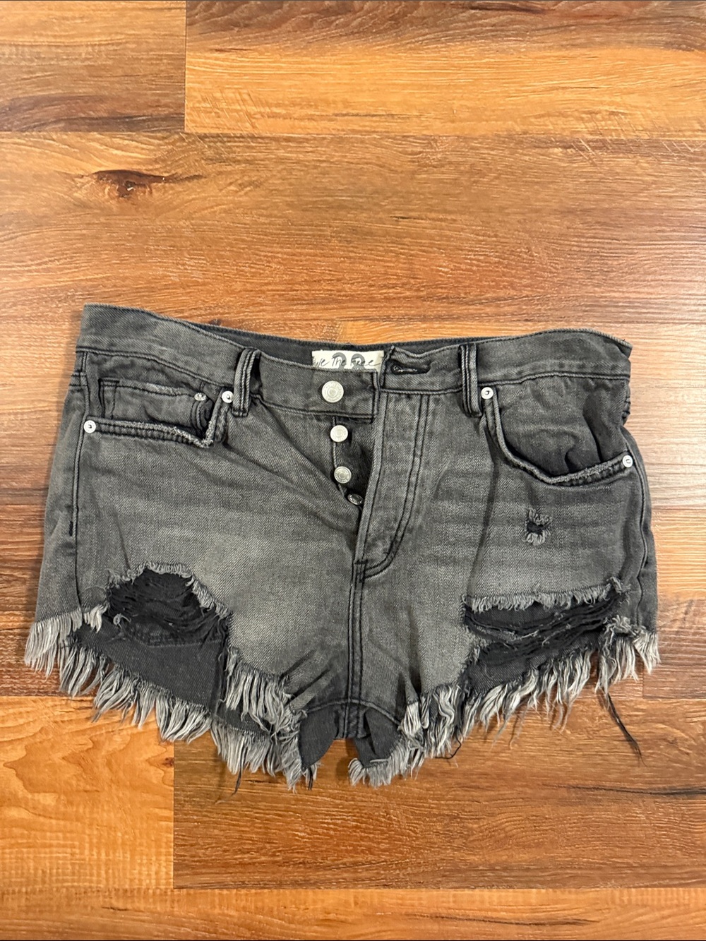 We The Free Washed Black Distressed Denim Cutoff Shorts
